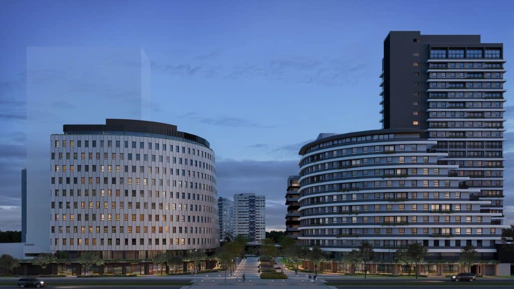 Imagem de um empreendimento imobiliário moderno, com duas torres imponentes e fachada contemporânea, destacando o Parque Una em Pelotas.